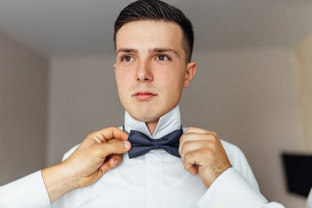 istock the groom in a wedding suit, posing in nature 1080519736