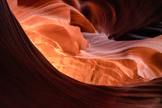 Antelope Canyon In The Middle Of The Afternoon The afternoon sun streaming into the beautiful lower Antelope  Canyon in Page Arizona glen canyon dam stock pictures, royalty-free photos & images