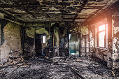 Burned interiors after fire of industrial or residential building. Fire consequences concept
