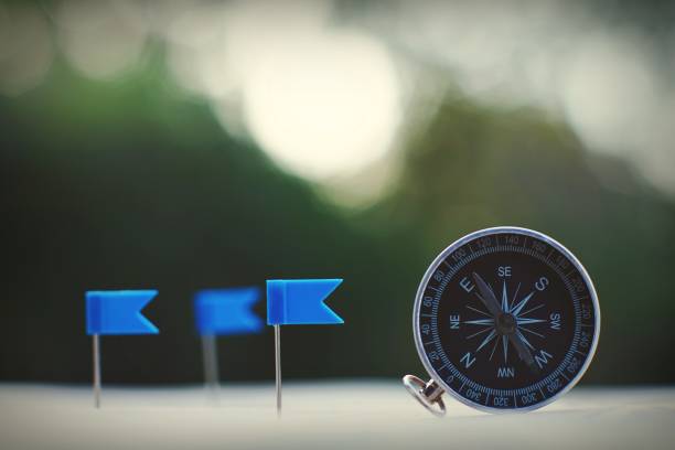 istock Compass and flag pins on blur vintage world map, journey concept, copy space 1080544342