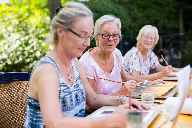 istock Senior women painting as recreational activity. 1080548236