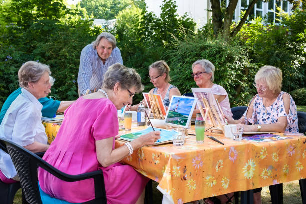 istock Senior ladies taking art lessons. 1080548456