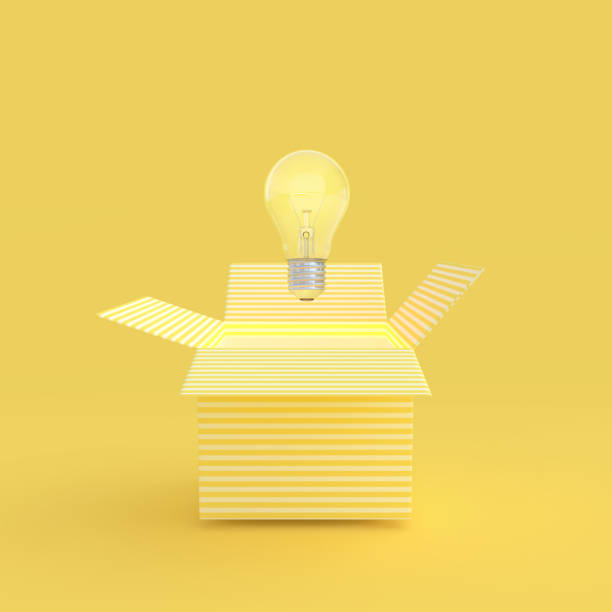 the light bulb drifted out of the gift box yellow color - drifted imagens e fotografias de stock