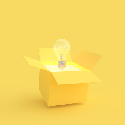 The light bulb drifted out of the gift box yellow color with clipping path. New idea and innovation concept and minimal style, 3D Render.