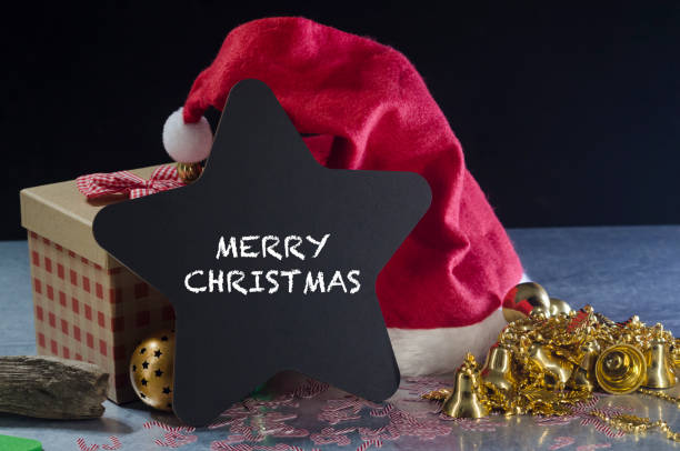 istock Star shape chalkboard with the text merry christmas 1080571148