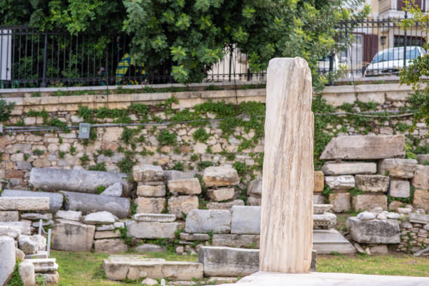 Athens, Greece - October 16, 2018: The ruins of a beautiful ionic column in the ancient Roman Forum ruins, in the Monastiraki neighborhood.
