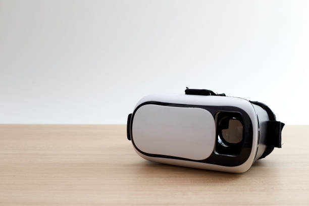 istock Virtual reality glasses helmet headset on wooden background. Future technology concept. 1080575468