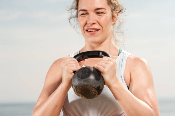 istock Young fit woman training with kettle bell 1080584206