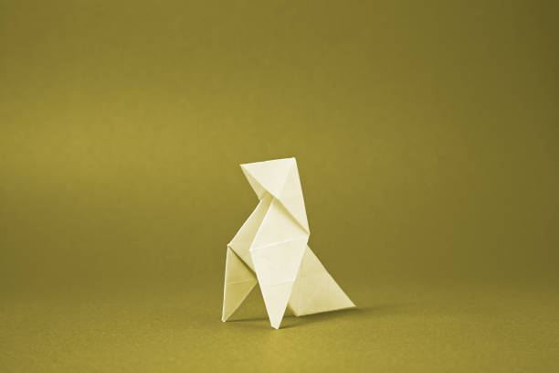 istock Origami paper bird on a red background 1080589678