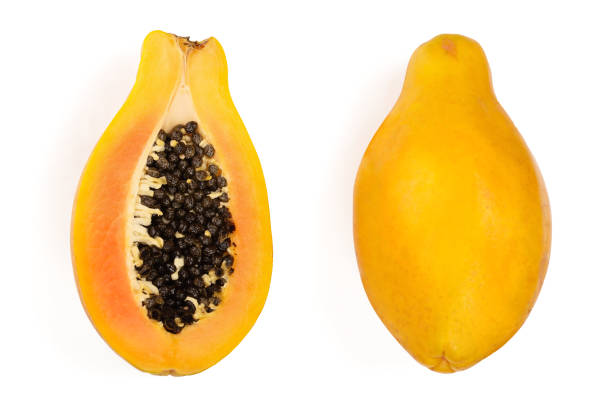 istock ripe papaya and half isolated on a white background. Top view. Flat lay 1080590076