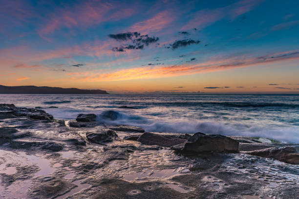 istock Sunrise Seascape with Streaky Clouds 1080591416