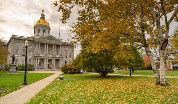 Fall Color Autumn Leaves Statehouse Grounds Concord New Hampshire Fall leaves on the lawn at the State Capital Building of New Hampshire at Concord concord new hampshire stock pictures, royalty-free photos & images