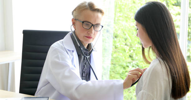istock Doctor using stethoscope for examining patient  in his office at Hospitals 1080620060