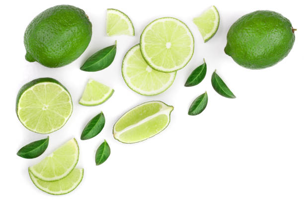 istock sliced lime vith leaves isolated on white background with copy space for your text. Top view. Flat lay pattern 1080622284