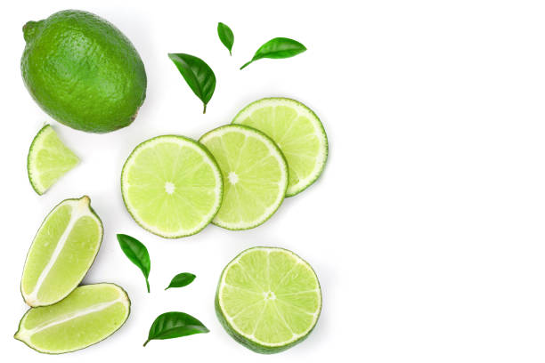 istock sliced lime vith leaves isolated on white background with copy space for your text. Top view. Flat lay pattern 1080622368