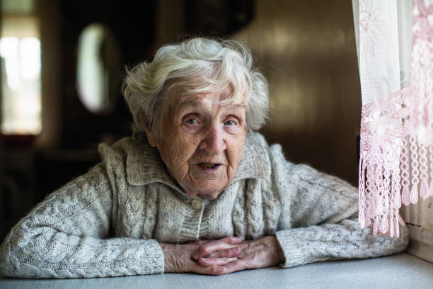 istock Gray-haired elderly woman portrait looking at the camera. 1080622734
