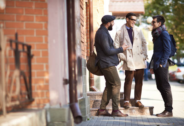 istock Young Men Talking Outdoors 1080634968