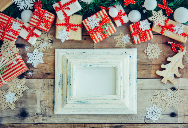 istock Christmas background with decorations and red gift boxes on the wooden board 1080640734