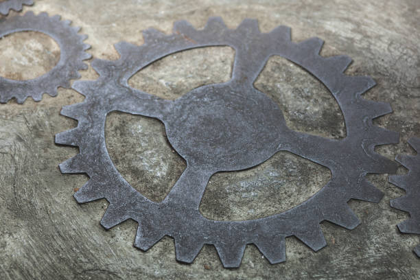 istock Old and rusty gears inside the concrete wall 1080661204