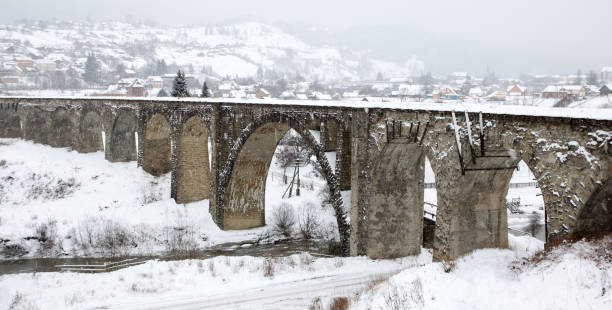 istock old railway aqueduct, stone bridge. snow, winter time. vorokhta mountains 1080661678