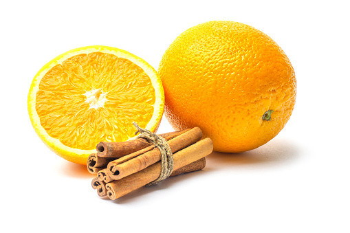 Fresh oranges citrus with cinnamon sticks isolated