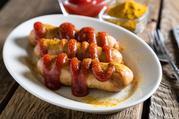 istock Curry wurst. German sausages with ketchup and curry 1080677572