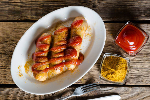 istock Curry wurst. German sausages with ketchup and curry 1080677774