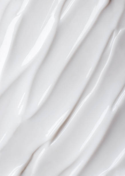 Beauty industry. Close-up brushstroke of face cream on white background. Copy space. lotion texture stock pictures, royalty-free photos & images