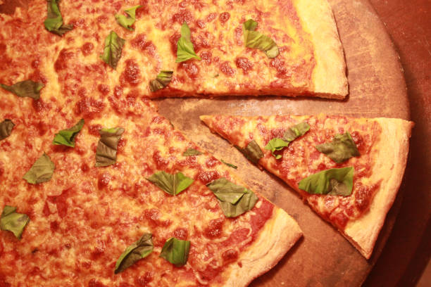 istock Hot big pepperoni pizza. Tasty pizza composition with melting cheese bacon tomatoes ham paprika steam smoke 1080679892