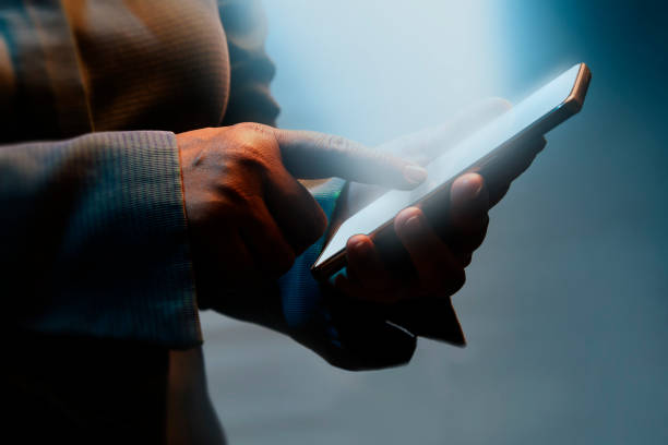 istock Girl pointing finger on glowing smartphone. 1080686228