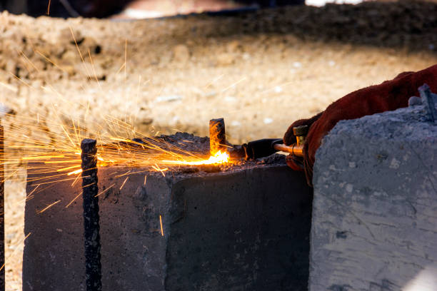 istock The worker is cutting a rebar on the concrete with an oxygen-fuel flame. 1080691880