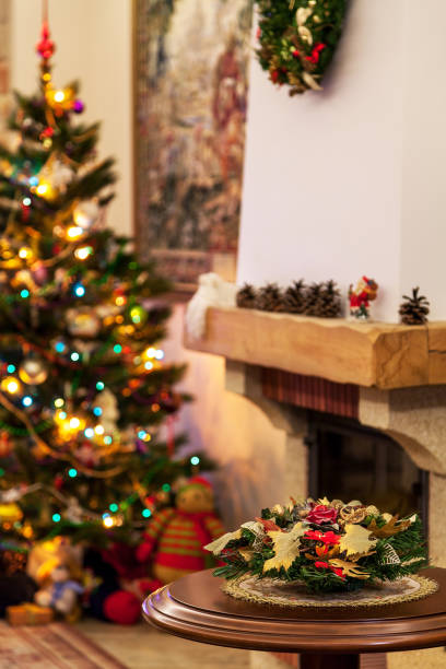 istock New Year bouquet on Christmas tree and fireplace defocused background 1080692012