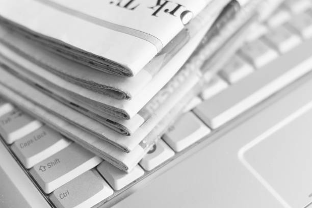 istock Newspaper and laptop 1080692064