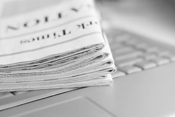istock Newspaper and laptop 1080692130
