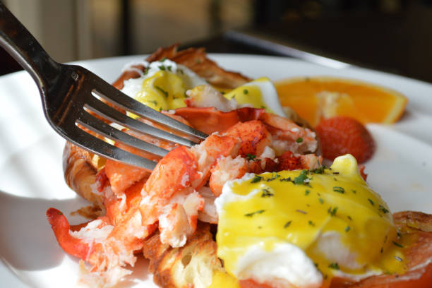 Seafood set with Lobsters, Clams, Fish, Blue Clabs, Big Prawns, Mussels and Calamari Squids with pieces of lemon & vetgetables