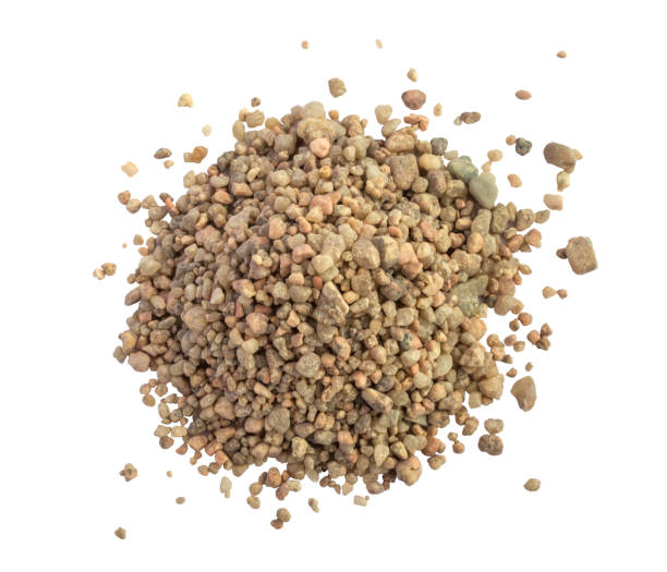 Heap or pile of coarse sand A pile or heap of coarse sand on a white background top view. Grit from Costa Brava region of Spain gravel mound stock pictures, royalty-free photos & images