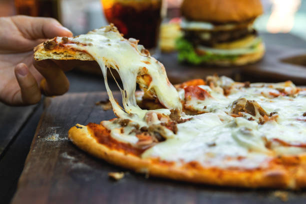 istock Delicious pizza with mozzarella cheese, minced meat and bacon 1080702786