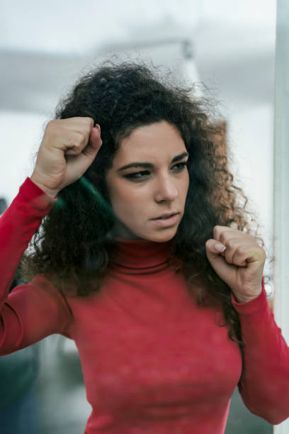 istock Sad Woman Looking Through the Window 1080702958