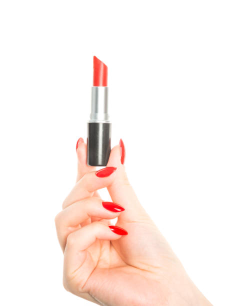 istock Hand With Red Nails Holding Red Lipstick 1080703452