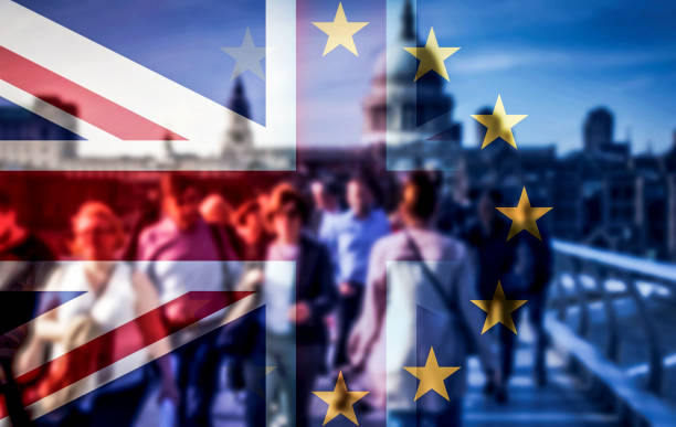 brexit concept - double exposure of flags and people walking on Millenium Bridge stock photo
