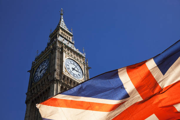 brexit concept - double exposure of flag and Westminster Palace with Big Ben stock photo