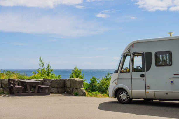 Tourism vacation and travel. Camper van and rocky coast landscape of southern Norway with an ocean view in Rogaland county Norway.
