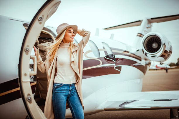 istock Young successful woman exiting a private airplane 1080719878
