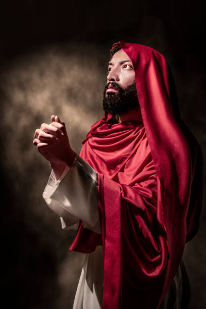 istock Jesus christ praying to god with hand gesture 1080726330