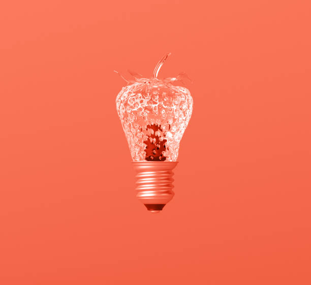 istock Glass textured strawberry lightbulb idea on creative Leaving Coral background. 1080734062