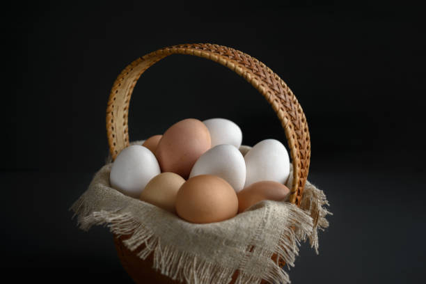 istock eggs in a birch-bark basket and a linen cloth on a dark background 1080739286