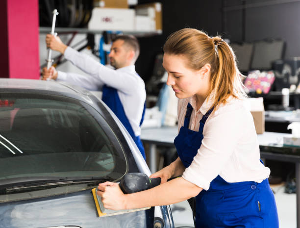 istock Woman mechanic sanding automobile body 1080740480