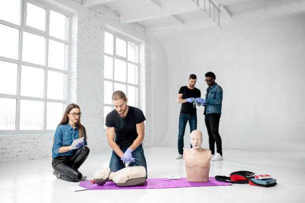 istock Group of young people during the first aid training 1080740870