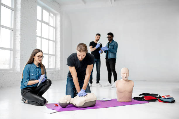 istock Group of young people during the first aid training 1080740876