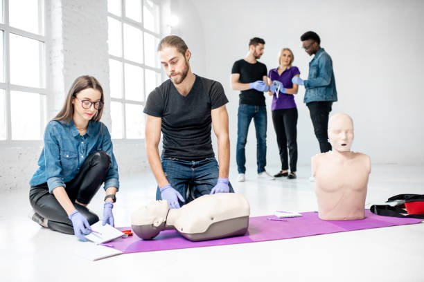 istock Group of young people during the first aid training 1080740990